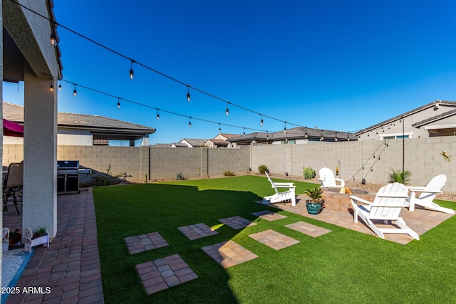 view of yard featuring a fire pit and a patio