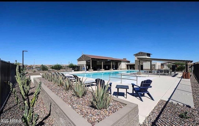 view of swimming pool with a patio area and a pergola