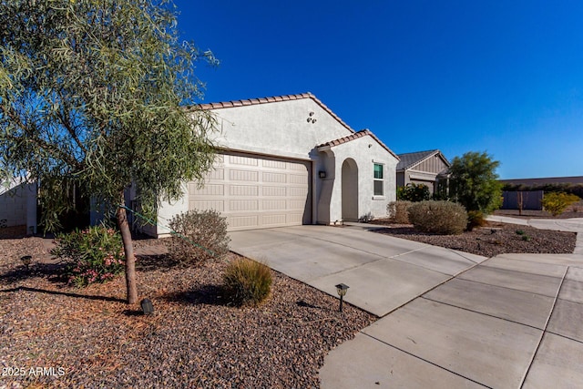 mediterranean / spanish-style house featuring a garage