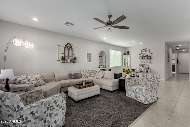 tiled living room featuring ceiling fan