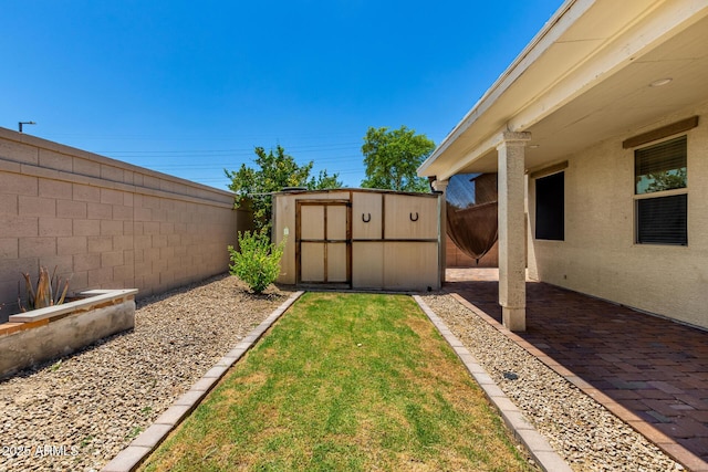 18669 W Vista Norte St, Goodyear, AZ 85338 - fenced backyard with a shed and a patio
