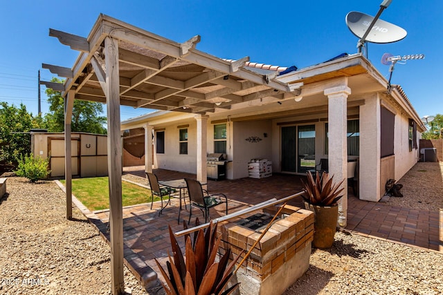 18669 W Vista Norte St, Goodyear, AZ 85338 - view of patio / terrace with a shed, a fire pit, and a grill