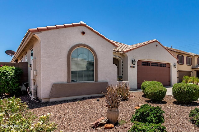18669 W Vista Norte St, Goodyear, AZ 85338 - mediterranean / spanish-style house with a garage, stucco siding, and a tile roof