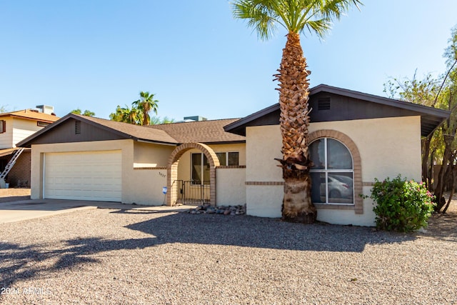 single story home with a garage