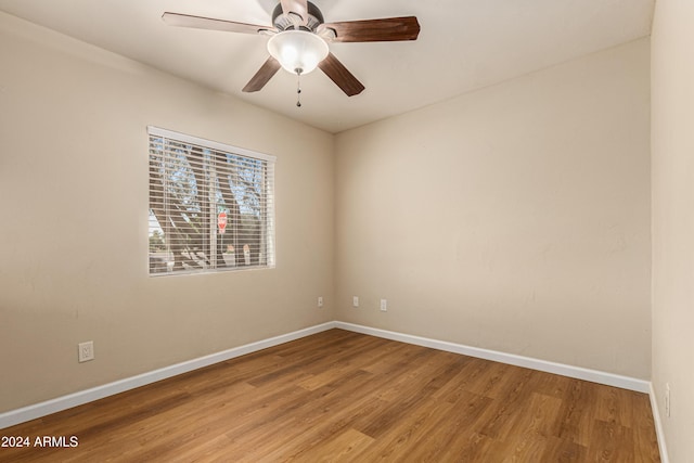 unfurnished room featuring hardwood / wood-style flooring and ceiling fan