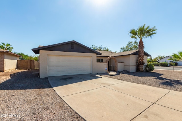 ranch-style home with a garage