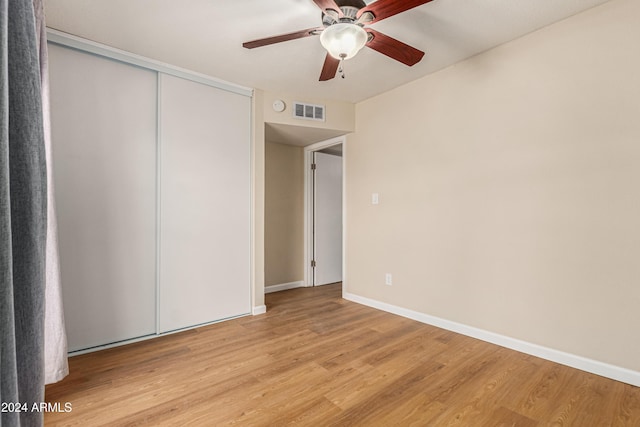 unfurnished bedroom with a closet, ceiling fan, and light hardwood / wood-style floors