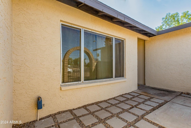 view of property exterior with a patio