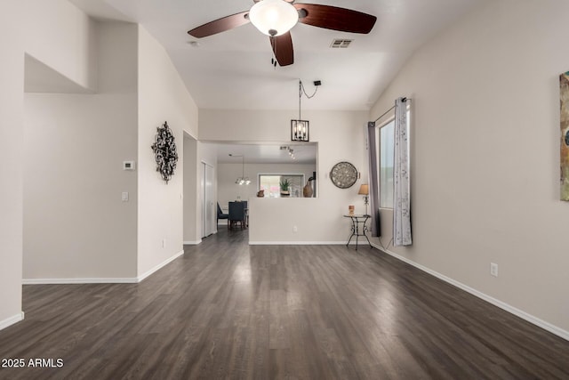 unfurnished living room with a ceiling fan, baseboards, visible vents, and dark wood-type flooring