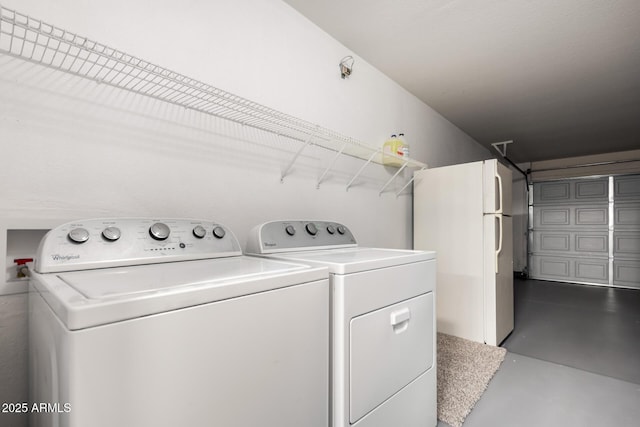 washroom with laundry area and washing machine and dryer