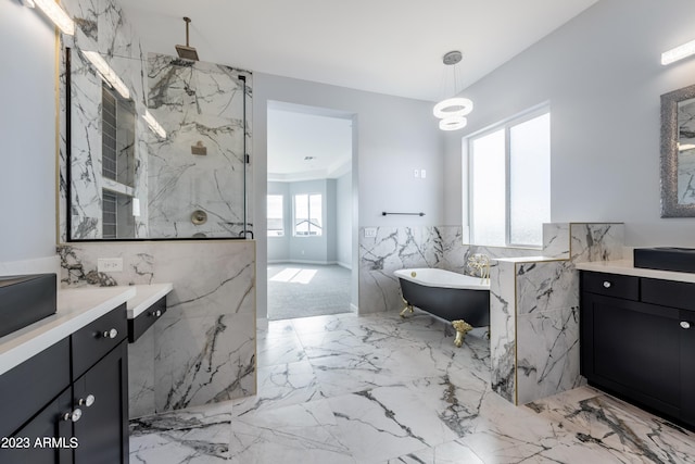 bathroom featuring vanity and independent shower and bath