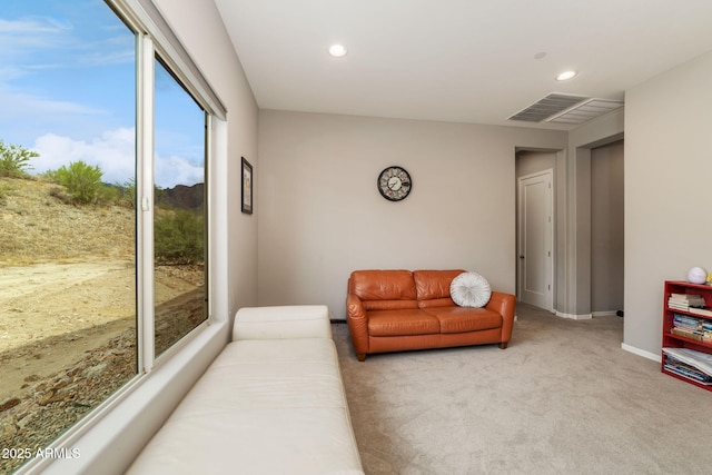 living room with light colored carpet