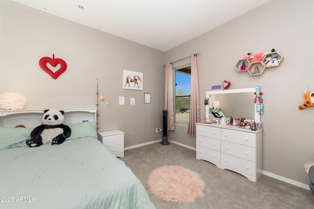 bedroom featuring light carpet