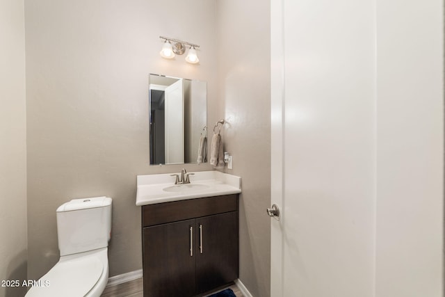 bathroom with vanity and toilet