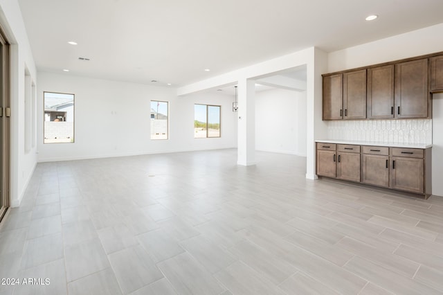 interior space featuring visible vents, recessed lighting, and baseboards