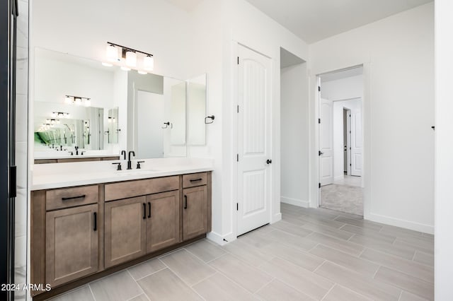 bathroom featuring vanity and baseboards