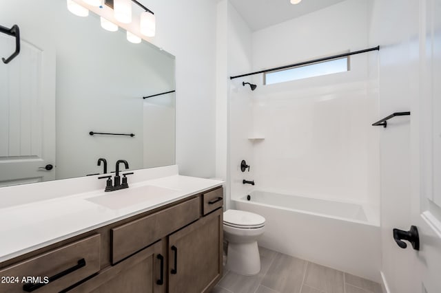 full bath featuring bathing tub / shower combination, toilet, and vanity