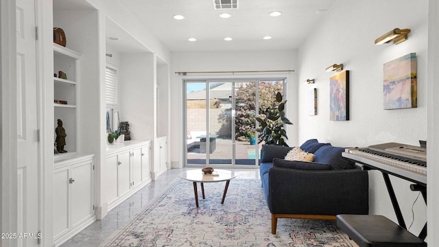 living room featuring recessed lighting, marble finish floor, and visible vents