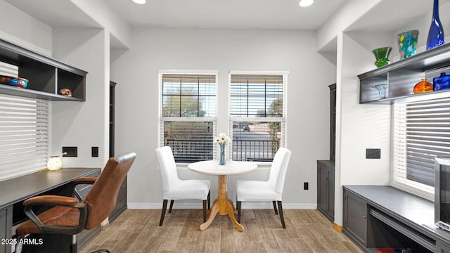 office area with light wood-style flooring, baseboards, and recessed lighting