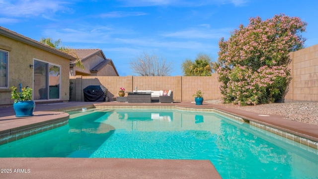 view of swimming pool with a fenced in pool, a patio, outdoor lounge area, a grill, and a fenced backyard