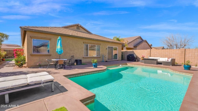 view of pool featuring a fenced backyard, a patio, and an outdoor hangout area