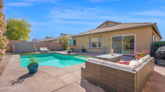 view of swimming pool with a patio, outdoor lounge area, a fenced backyard, and a fenced in pool