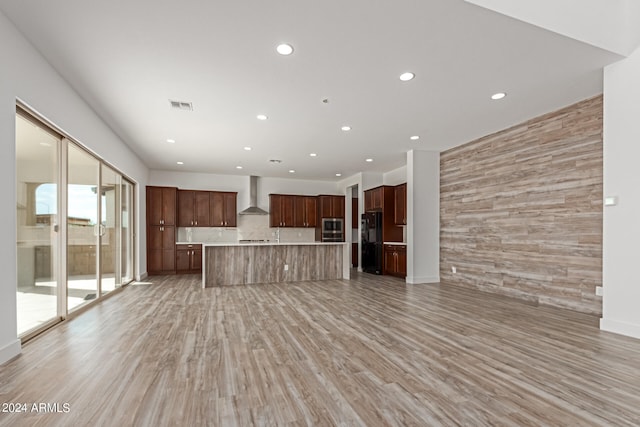 unfurnished living room with light hardwood / wood-style flooring