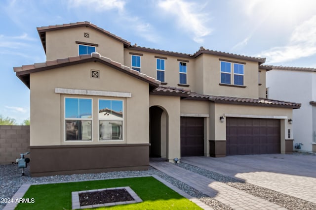 mediterranean / spanish-style house featuring a garage