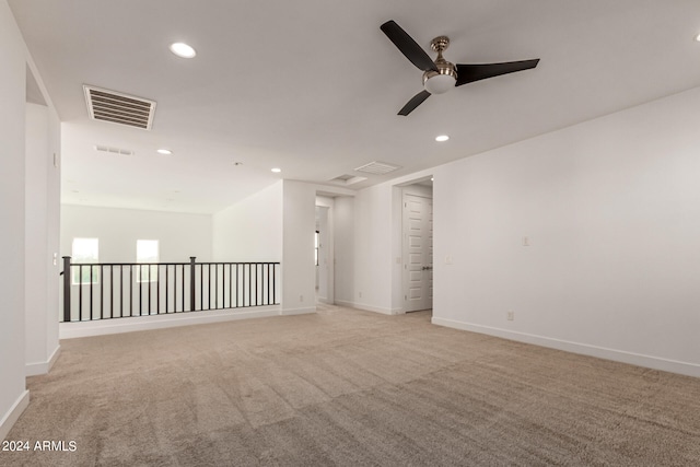 carpeted empty room with ceiling fan