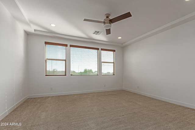 spare room with carpet floors and ceiling fan