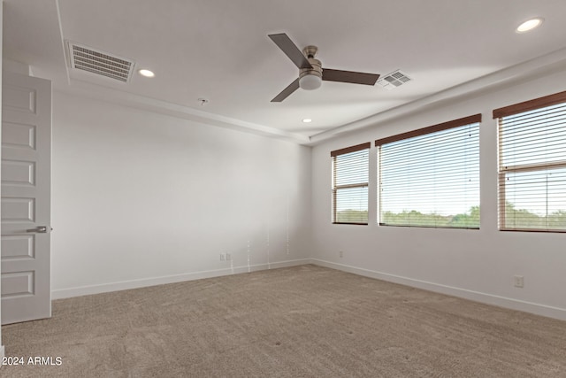 empty room with ceiling fan and carpet