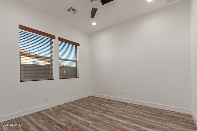 spare room featuring ceiling fan and hardwood / wood-style floors