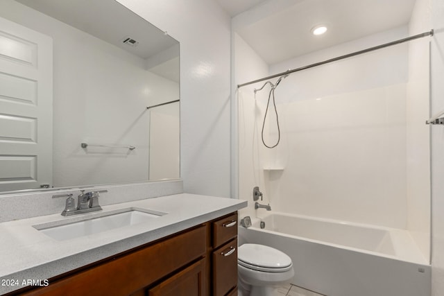 full bathroom featuring toilet, bathtub / shower combination, vanity, and tile patterned floors