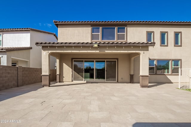 back of house featuring a patio