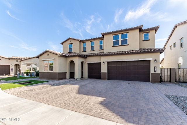 mediterranean / spanish house featuring a garage