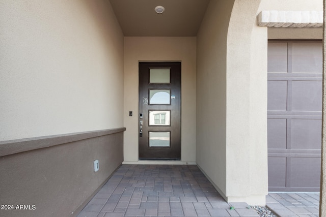 property entrance featuring a garage