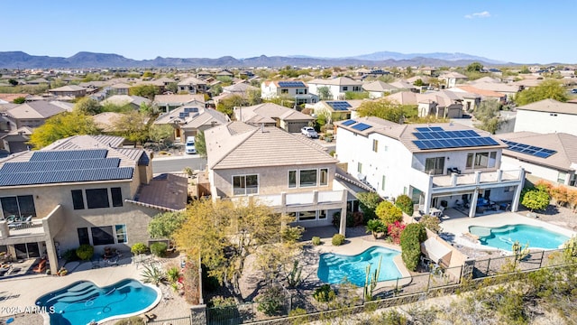 birds eye view of property with a residential view and a mountain view