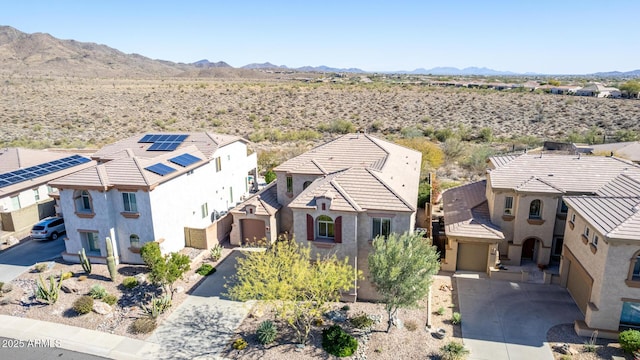 drone / aerial view featuring a residential view and a mountain view