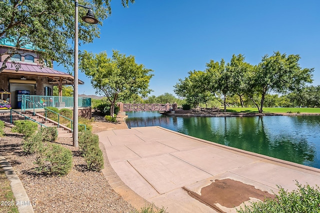 view of home's community with a water view