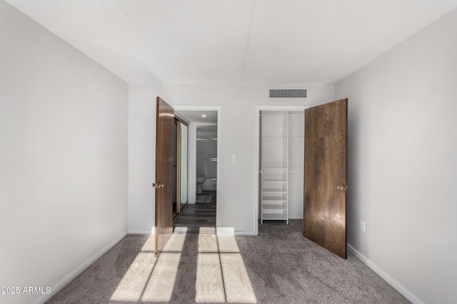 7402 E Carefree Dr Unit 319, Carefree, AZ 85377 - unfurnished bedroom with dark carpet and a closet