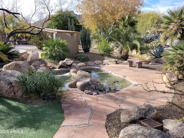 7402 E Carefree Dr Unit 319, Carefree, AZ 85377 - view of yard featuring a garden pond