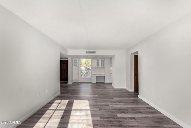 7402 E Carefree Dr Unit 319, Carefree, AZ 85377 - unfurnished living room with dark hardwood / wood-style floors