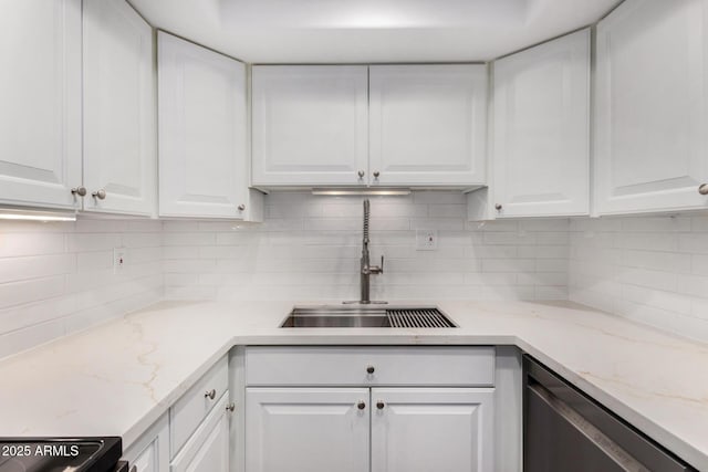 7402 E Carefree Dr Unit 319, Carefree, AZ 85377 - kitchen with white cabinets, backsplash, dishwasher, and sink