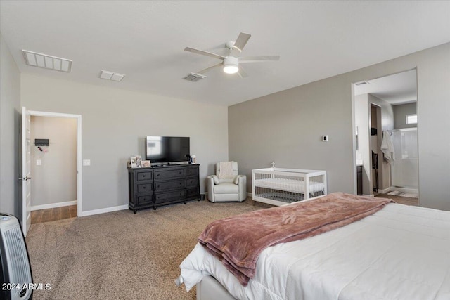 carpeted bedroom featuring baseboards and visible vents