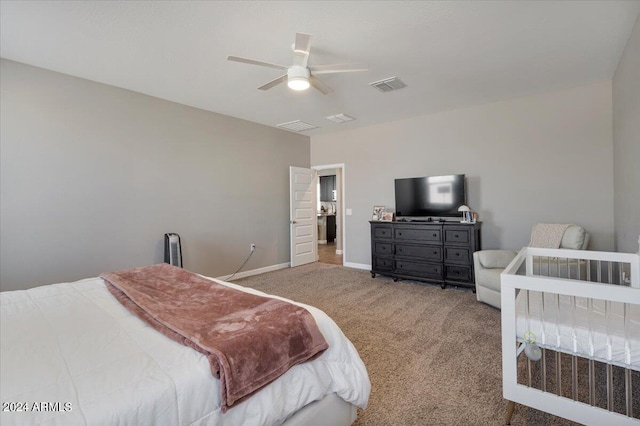 bedroom featuring light colored carpet and ceiling fan