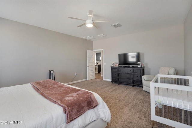 bedroom featuring a ceiling fan, baseboards, carpet, and visible vents