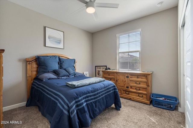 bedroom with ceiling fan and carpet