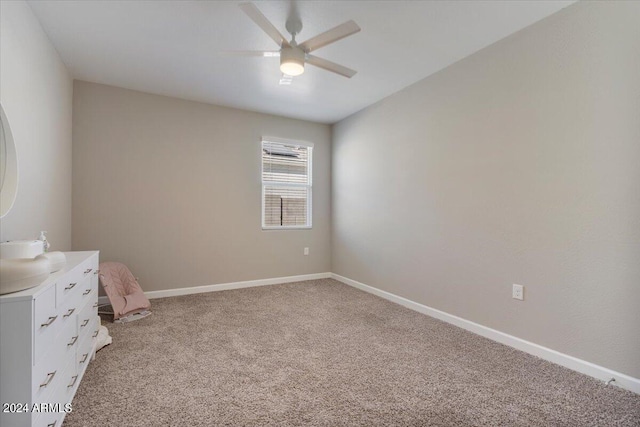 unfurnished bedroom featuring light carpet and ceiling fan