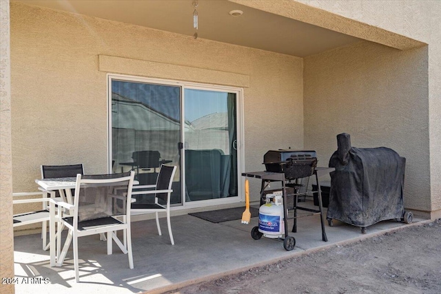 view of patio featuring outdoor dining area