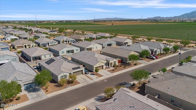 drone / aerial view featuring a residential view and a mountain view